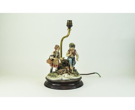 Capodimonte - Signed Figural Table Lamp, Young Boy and Girl With Dog. Signed Meneghetti. 14 Inches High. Damage to Dogs Nose.