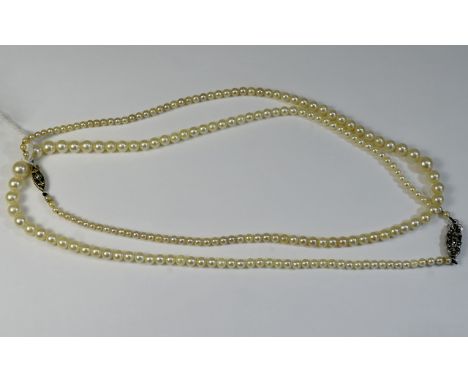 1930's Nice Quality Pair of Pearl Necklaces with Excellent Lustre, One Of Clasps are Made of Platinum and 15ct Gold. Fully Ha