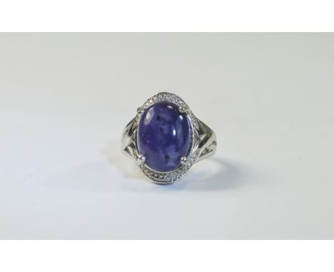 Purple Opal Ring, an oval cut cabochon of one of the most unusual colours of opal, a mottled deep purple, measuring 8cts, set