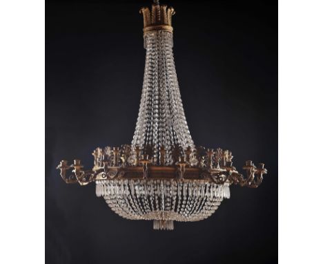 A thirty six lamps Bag Chandelier, carved and gilt wood, glass strings and pendants, gilt metal light arms with carved and gi