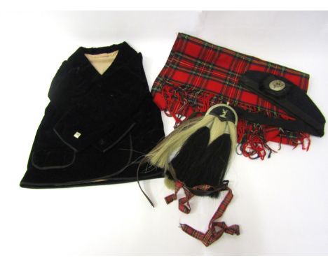 An early to mid 20th Century child's Scottish kilt jacket in black velvet, sporran, black wool Glengarry Military cap bearing