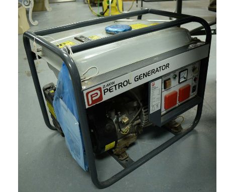 A Performance Power Tools 2.4KW petrol generator, with an instruction manual.