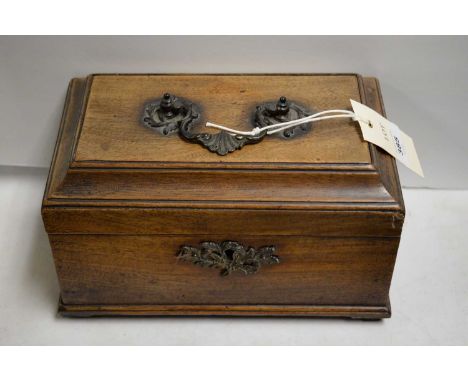 A Victorian mahogany tea caddy, of rectangular form, with applied cast metal handle and lock escutcheon, the interior fitted 