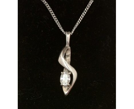 A diamond and palladium pendant, the oval brilliant cut diamond estimated to weight 0.20 carats, in a shaped palladium mount,