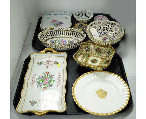 A selection of decorative ceramics, including: two pierced Dresden ceramic bowls, decorated with roses and flowers within blu