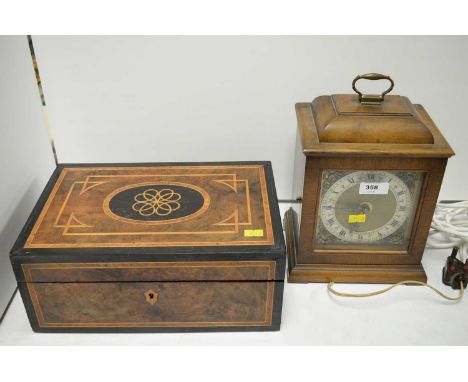 An Edwardian inlaid and ebonised burr walnut stationery box, the hinged lid with geometric design, opening to reveal fitted a
