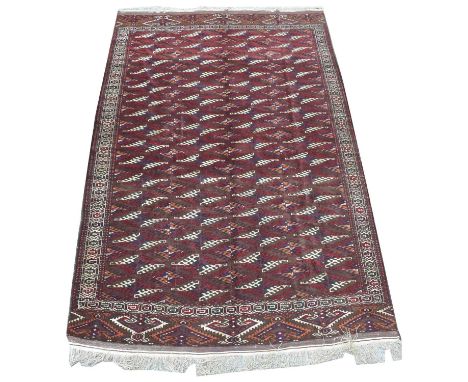 A Yamod carpet, with repeated stylized leaf design, 355 x 215cms.