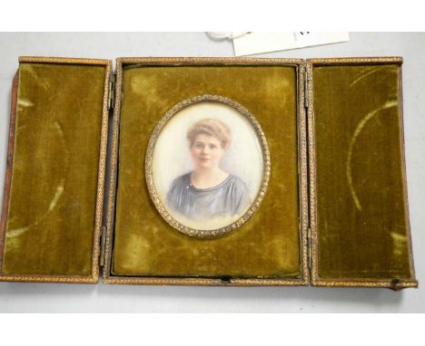 A mid 20th Century portrait miniature of a lady, signed and dated indistinctly, likely 1950/1956, contained within a gilt-too