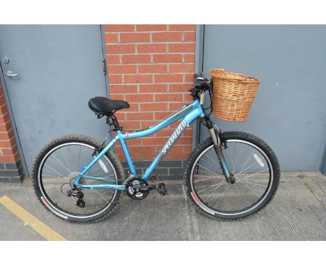 A woman's Specialized Hardrock Sport mountain bike, in electric blue, D4W ( Designs for women). RST Gila fork, 8-speed Shiman