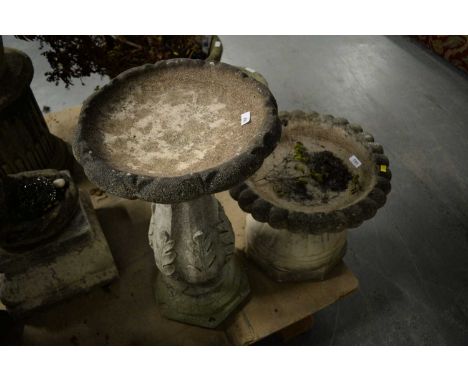A 20th Century stone composite birdbath, the circular bowl over a baluster pillar support decorated with leaves, over a hexag