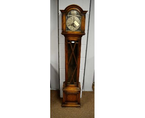 Greenwood &amp; Sons, Leeds &amp; Huddersfield: an early 20th Century oak Grandmother clock, the silvered dial with Roman num