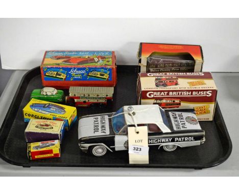 A selection of loose and boxed model vehicles, including: a Schuco Radio 4012 model car, in box; a Great British Buses diecas