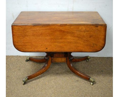 A 19th Century mahogany Pembroke breakfast table, with one frieze and one faux drawer, raised on a waisted stepped square for