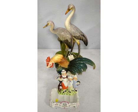 A 20th Century French ceramic figure group of two cranes, with painted mark to underside, 41cms high; together with a Capodim