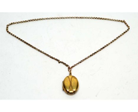 A yellow metal locket pendant (probably plated front and back), on chain stamped '9c'.