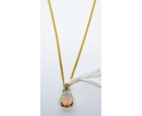 An opal and diamond pendant, the faceted pear cut opal set under a diamond bale, 9ct yellow gold mount, on a 9ct yellow gold 