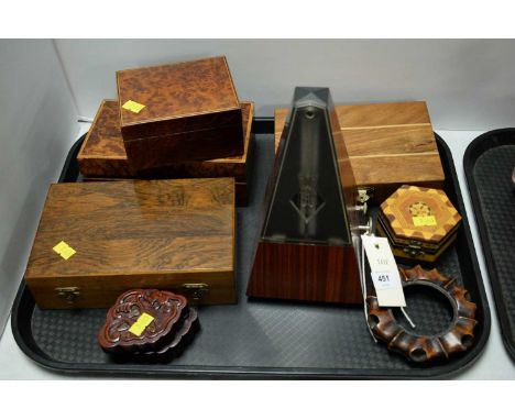 A collection of stained wood items, including: a late 20th Century West German metronome; an inlaid wood games box; two burr 