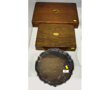 An early 20th Century oak cased canteen of cutlery, each piece fitted with mother-of-pearl handle, the canteen 29cms wide; to