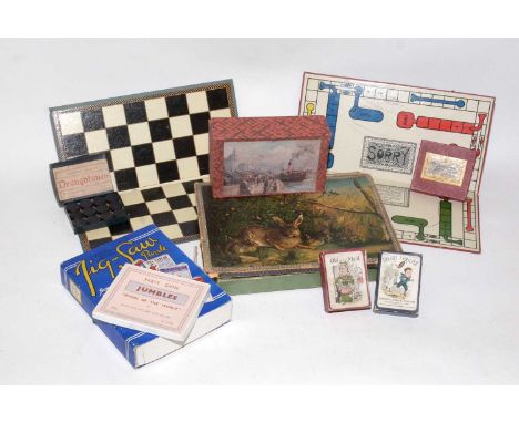 Antique and vintage children's games and puzzles, including a late Victorian wooden jigsaw puzzle depicting a hare and levere