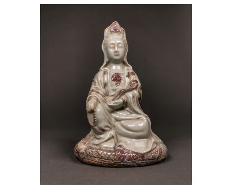 Ca. 20th C AD or earlier/Qing style. A beautiful Chinese porcelain figure of Guanyin; the bodhisattva is depicted seated with