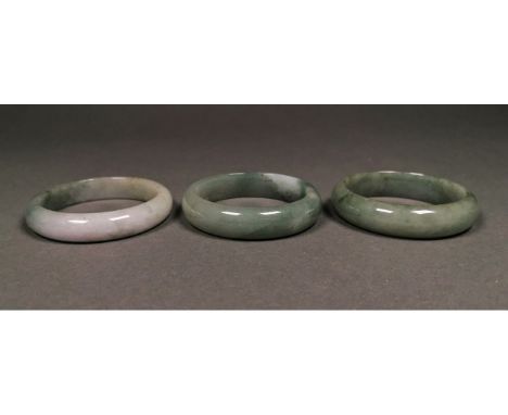 A fantastic set of three celadon jade bracelets. Regarded as the most precious stone in ancient China, it symbolizes purity a