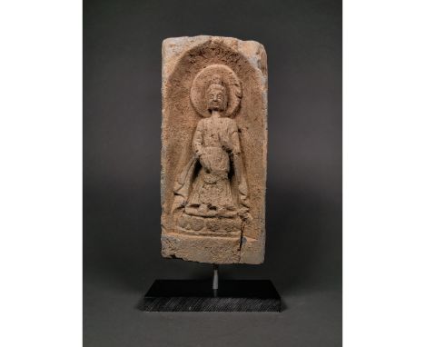 Ca. 386-534 AD. A rectangular ceramic brick with a recess to the obverse, facing nimbate standing figure of Buddha. Good Cond