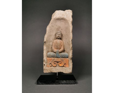 Ca. 386-534 AD. A rectangular ceramic brick with a recess to the obverse, featuring a seated Buddha on a lotus flower. Good C