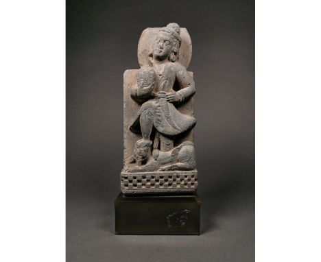 Ca.200 AD Beautiful large Gandhara schis stone panel depicting a standing warrior slaying a beast/lion?. Possibly a represena