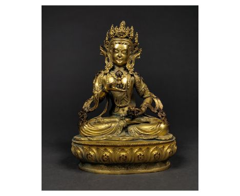 ca. 1700 AD or earlier; A fine Buddha seated in vajrasana on a lotus, his body in slight tribhanga, beautifully rendered fing