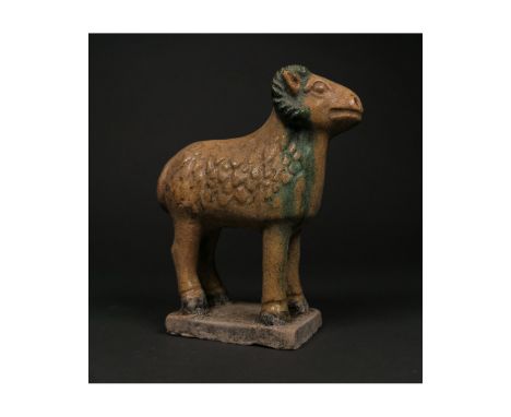 Ca. 1368-1644 AD. Chinese Ming Dynasty glazed terracotta figure of a RAM; presented standing on a rectangular base; well pres