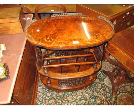 Victorian oval shaped top burr walnut Canterbury whatnot, the inlaid brass galleried top above a sectioned undertier with sin