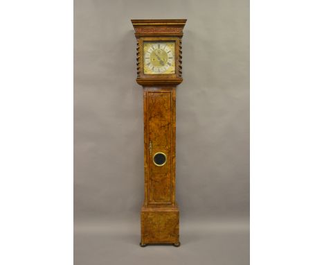 Figured walnut longcase clock with square hood with moulded cornice and fretwork frieze above flanking barley twist pilasters