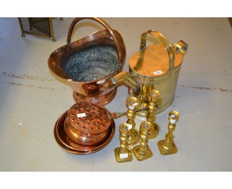 Brass watering can, copper coal scuttle, sieve, copper dish, iron handled copper pan, two pairs of brass candlesticks and ano