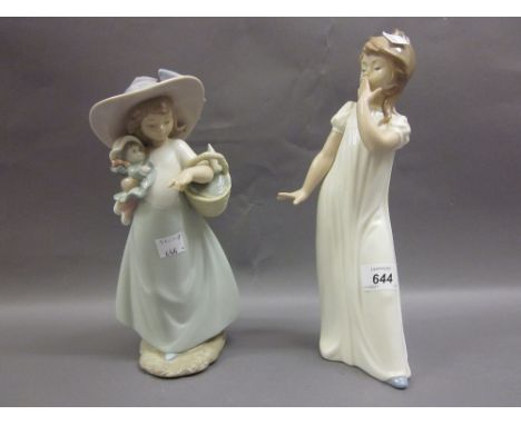 Nao figure of a young girl yawning and a girl holding a doll and basket