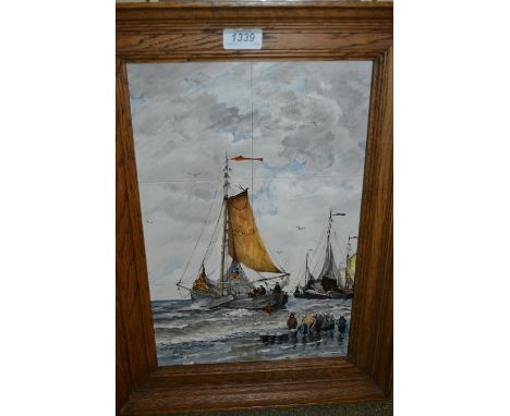 20th Century Delft tile picture painted with a scene depicting figures unloading fishing boats, signed, together with two mod