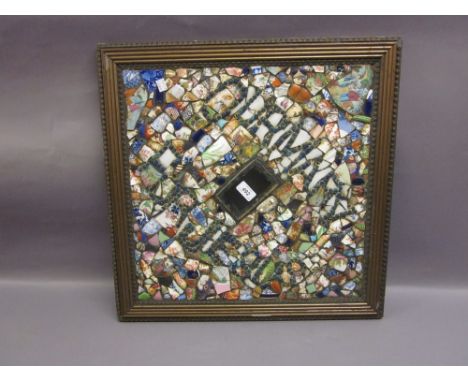 Framed mosaic panel formed from ceramic fragments