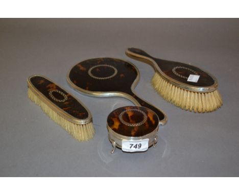 Birmingham silver and tortoiseshell four piece dressing table set including a trinket box with hinged cover