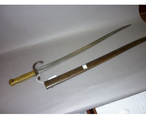 19th Century French bayonet with brass grip in a steel scabbard
