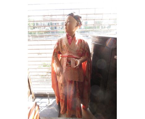 Oriental mannequin of a young girl with character mark signature to arm