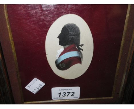 Oval watercolour portrait miniature silhouette of a bewigged gentleman with red jacket and blue sash, 3ins x 2ins