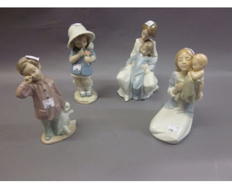 Four Nao figures, two of mothers with children, a girl in a bonnet with flowers and a young boy with teddy bear