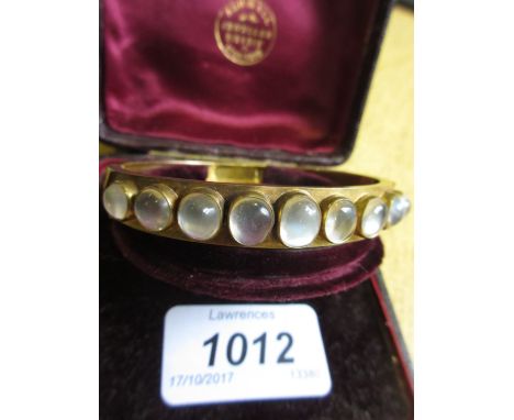 Victorian yellow metal bangle set moon stones in original fitted case