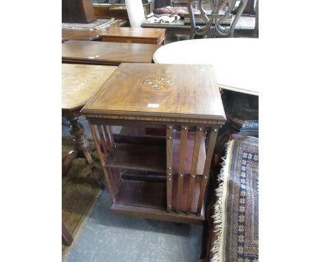 19th Century mahogany and inlaid revolving bookcase on crossover stand with brass and ceramic casters, 19.5ins square, 34ins 