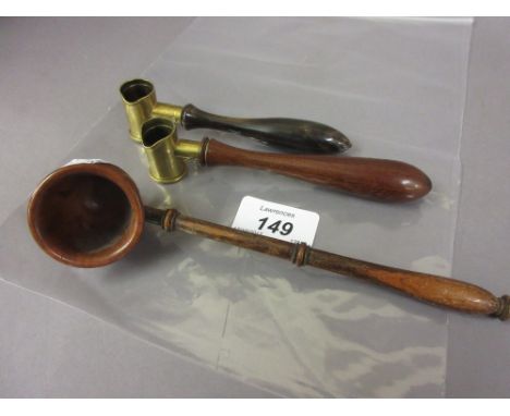 Two 19th Century brass and turned wooden measures for shot and powder, together with a small Treenware ladle