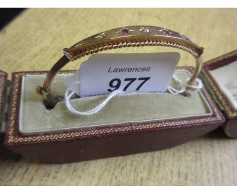 Victorian 9ct gold bangle set small rubies and diamonds in a red leather fitted case