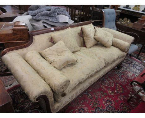 Reproduction mahogany sofa in Regency style, the carved reeded frame on sabre legs