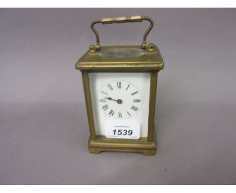 20th Century brass cased carriage clock with enamel dial having Roman numerals (lacking hand - a/f)