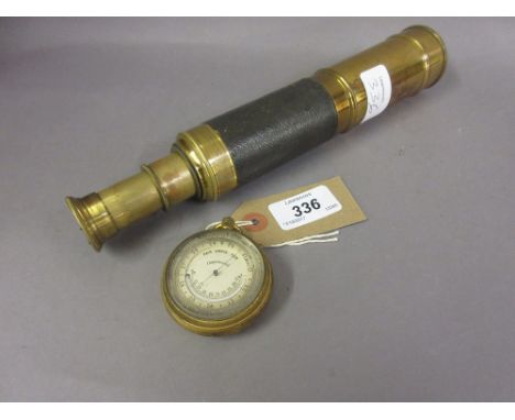 Brass cased pocket barometer and a small leather mounted telescope