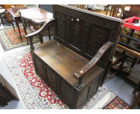 Victorian carved oak hall bench, the panel back above a box seat