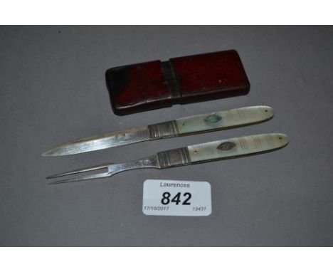 Georgian silver mother of pearl handled folding knife and fork in a leather travel case